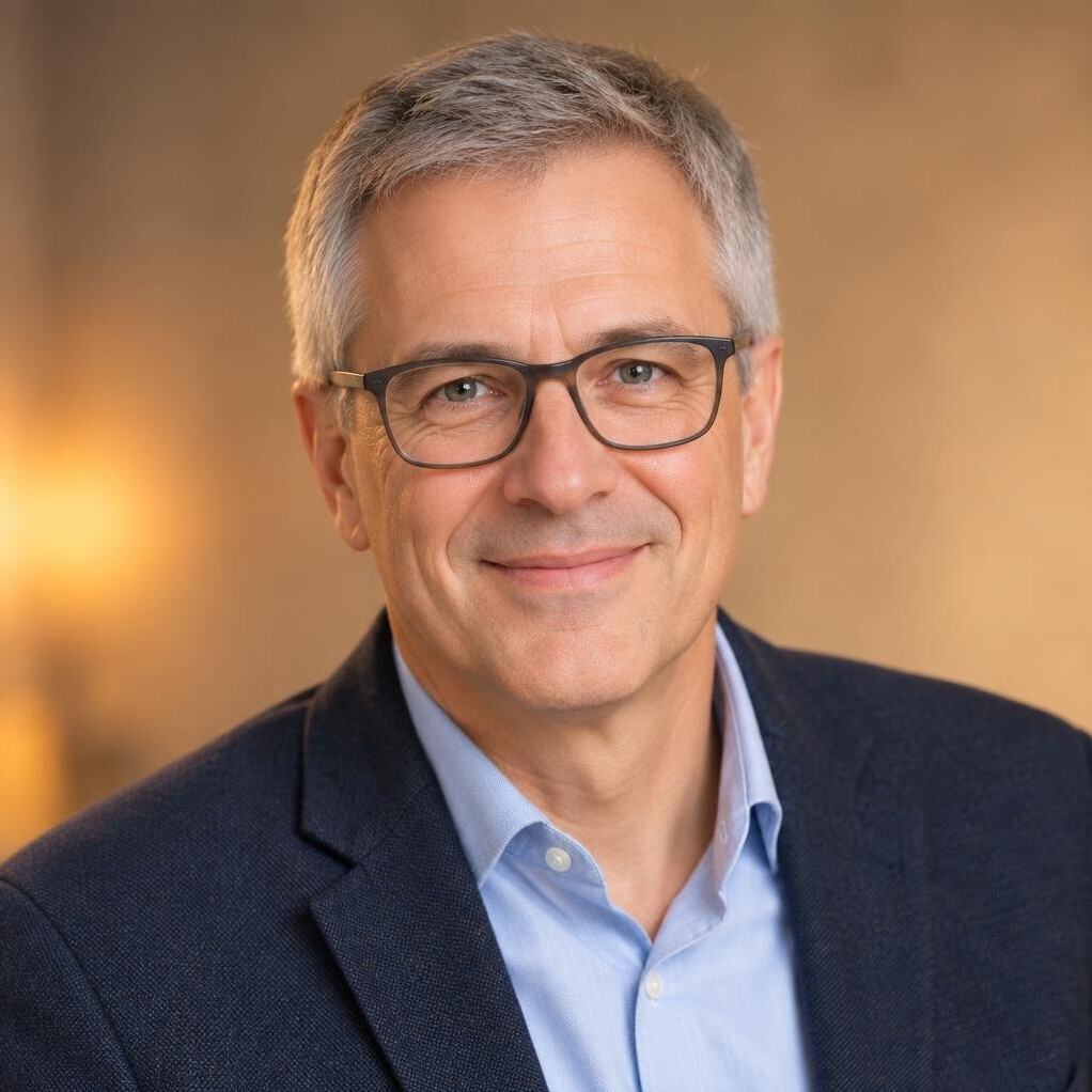 Swiss man in his fifties, journalist portrait with glasses